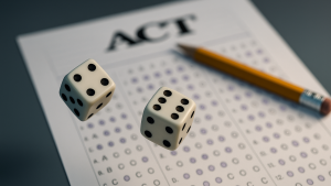 Two dice rolling over an ACT answer sheet with a pencil nearby, symbolizing the role of chance in the ACT superscore strategy.